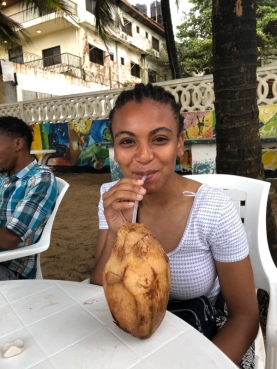 Olivia enjoying fresh coconut
