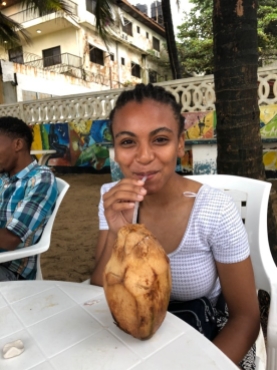 Olivia enjoying fresh coconut